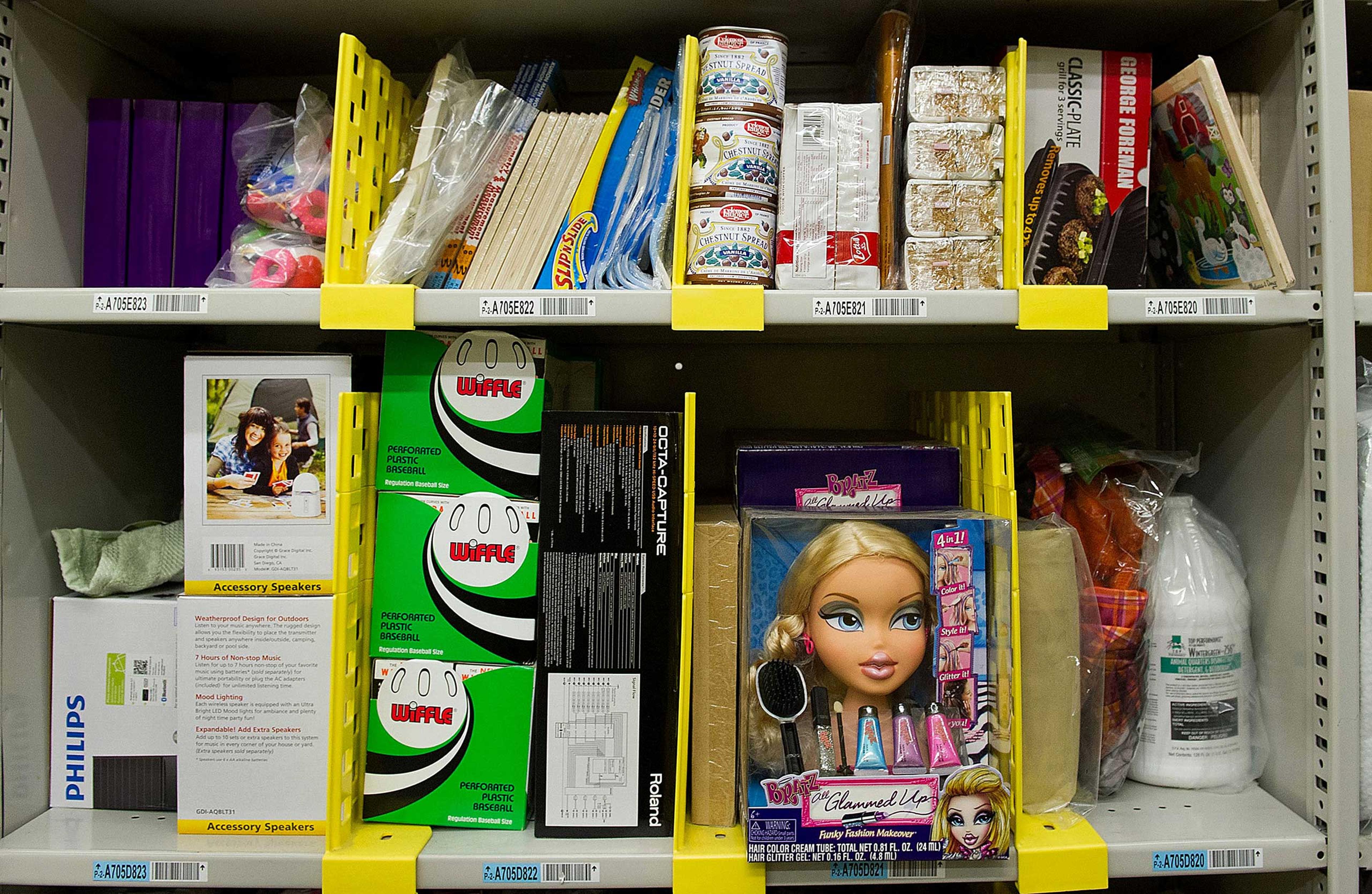 several shelves at an Amazon fulfillment center with heterogenous products